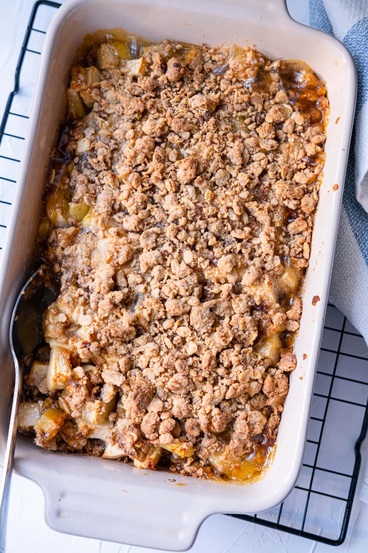 Baked crunchy apple crisp in a rectangular baking tray. 