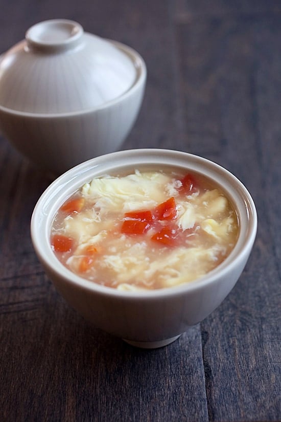 Easy and quick egg drop soup recipe made with eggs, tomatoes, and chicken broth.
